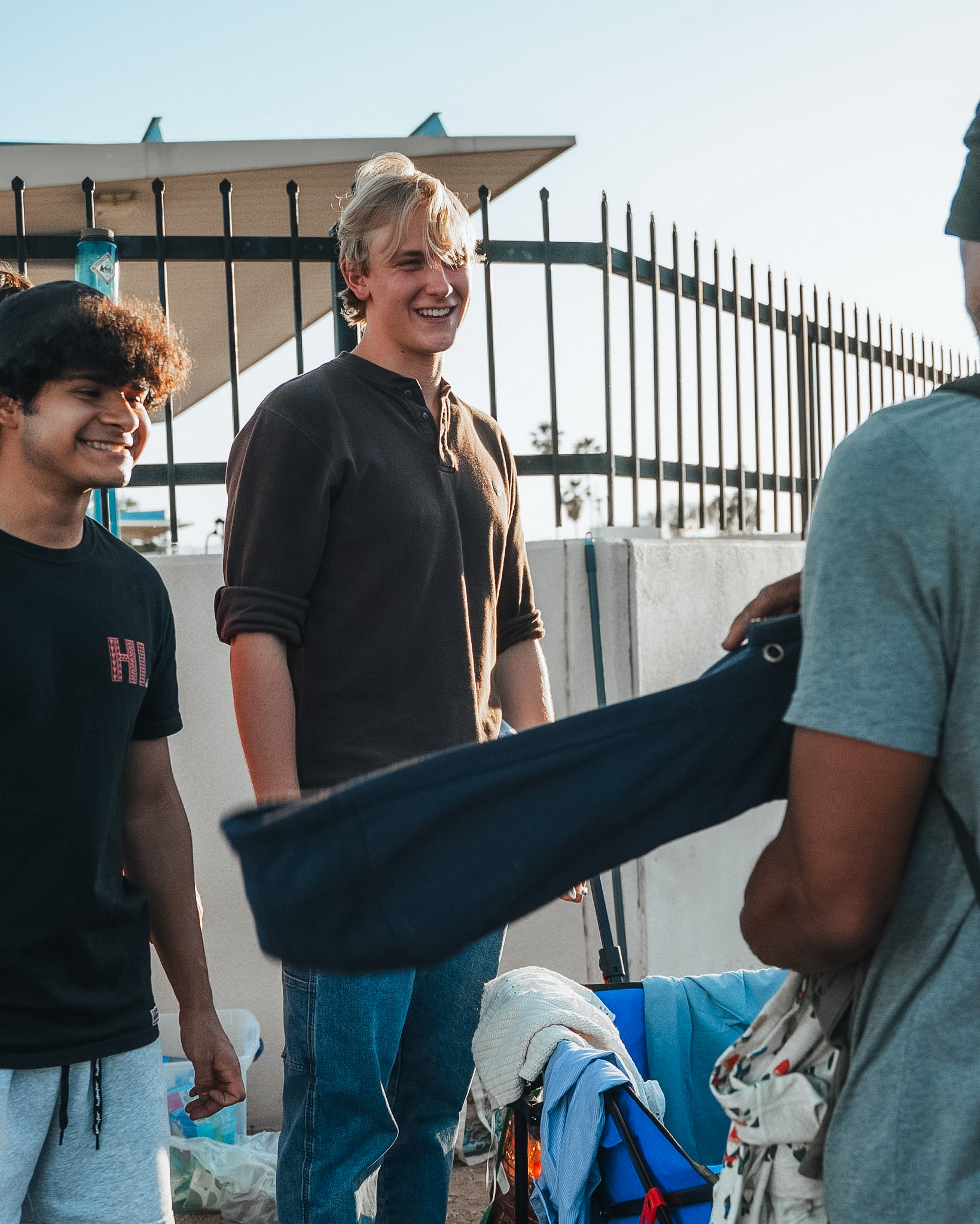 Volunteers laughing and connecting with a neighbor during outreach